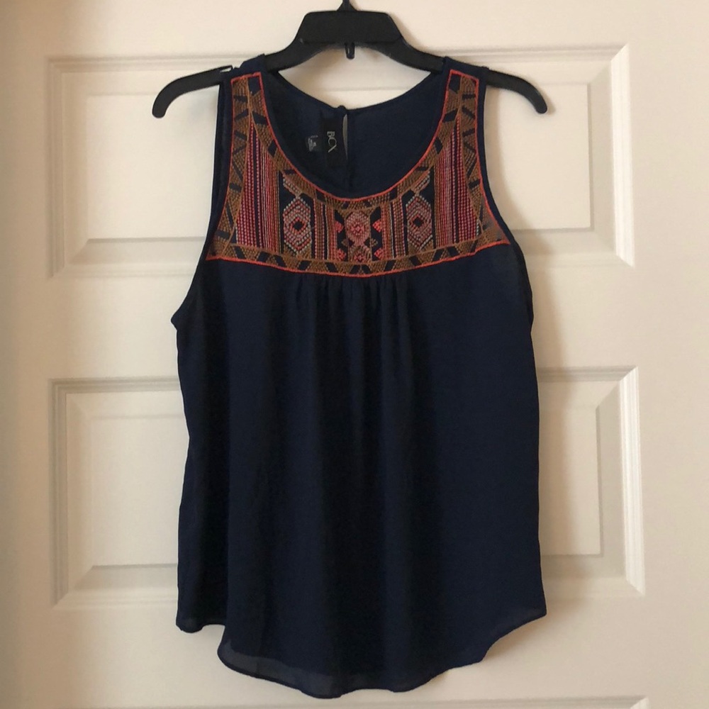 Embroidered sleeveless top.